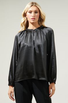 Romance is in the air. Embrace love around you in the Alcazar Blouse. Fashioned from a luxe satin, it shapes a ruffle split neckline framed by long balloon sleeves. It maintains a standard fit and can be styled tucked into high rise trousers and kitten heels.- Satin- Split neck- Balloon sleeves- Standard fit- Comes in 4 colorsSize + Fit - Model is 5'8" and wearing size XS- Measurements taken from size S - Chest: 20"- Length: 25" Fabric Self:97% Polyester 3% Spandex Style Number STT17104S High Rise Trousers, Long Balloons, Satin Blouse, Balloon Sleeves, Sweater Weather, Raglan Sleeve, Best Sellers, Nice Dresses, Kitten Heels