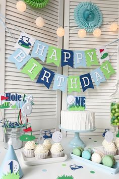 a birthday party with cake, cupcakes and decorations