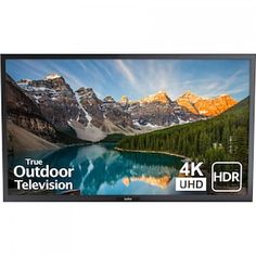 the 4k uhd tv is shown with mountains in the background