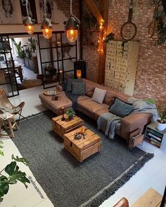 a living room filled with furniture and lots of plants