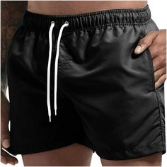 Men Breathable Three-point Pants Beach Shorts Sports Shorts Elasticated Lace-up Trousers Features: 1.It is made of materials, durable enough for your daily wearing. 2.Stylish and fashion design make you more attractive Handsome. 3.It can be worn with your favorite T-shirt, tank, etc. 4.Great for sport,outdoors,I am sure you will like it! 5.It's great to have a pair of these pants for outdoor sports. Product Description: Season:Autumn/Summer Gender: Men Occasion: Outdoor,Casual,Daily Material:100 Solid Drawstring Shorts For Outdoor, Drawstring Bottoms For Outdoor Beach Season, Drawstring Bottoms For Beach Season, Beach Season Drawstring Bottoms For Outdoor, Black Bottoms With Pockets For Beach Season, Black Beach Shorts For Outdoor, Black Beach Bottoms With Pockets, Black Pocketed Shorts For Beach Season, Black Leisure Bottoms For Beach Season