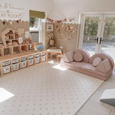 a living room filled with furniture and lots of storage space next to a sliding glass door