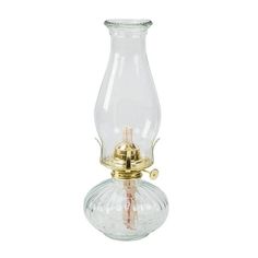 a glass vase with a gold base and a light bulb on the top, sitting in front of a white background