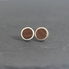 NEW Sterling Silver wood circle Stud Earrings - Handmade from Native Tasmanian Timber set in recycled and reclaimed hypoallergenic Sterling Silver. Minimalist, modern and inspired by nature, the perfect accessory for special occasions or for daily wear. A complimentary polishing cloth included with your order. Dimensions:10mm wide x 2mm deep with 8mm hallmarked Sterling silver earring posts + Sterling Silver Butterfly backs → Want to keep up with my latest designs and special offers?? Instagram: Silver Wood, Wood Circles, Circle Earrings Studs, Rain Forest, Circle Studs, Earrings Minimalist, Wood Earrings, Sterling Silver Studs, Minimalist Earrings