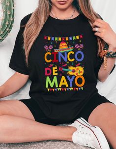 🎉 Get ready to fiesta in style with our vibrant Cinco De Mayo t-shirt! Made with ultra-soft Bella Canvas fabric, this shirt ensures both comfort and quality. Featuring a festive design inspired by the celebration of Mexican heritage and culture, it's the perfect attire for parties, gatherings, or simply showing off your love for the holiday. Whether you're sipping margaritas or indulging in delicious tacos, this shirt is sure to add a dash of flair to your festivities. Grab yours now and let th Multicolor Crew Neck Shirt For Cinco De Mayo, Multicolor Letter Print Tops For Cinco De Mayo, Cinco De Mayo Funny Print Crew Neck Top, Funny Print Short Sleeve Shirt For Cinco De Mayo, Casual T-shirt With Funny Print For Cinco De Mayo, Multicolor Casual T-shirt For Cinco De Mayo, Casual Multicolor T-shirt For Cinco De Mayo, Fun Cotton Tops For Cinco De Mayo, Casual Multicolor Shirt For Cinco De Mayo