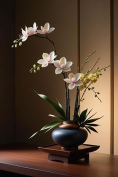 a vase filled with flowers on top of a wooden table