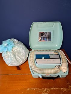 "Tested and Working! What a wonderful vintage hair dryer. This is a two in one dryer with a bonnet for your hair and a nail dryer area. This portable hair dryer comes with a spot to add perfume to scent your hair, a mirror and different temperature settings. The case and overall color scheme is a light teal blue, we refer to the color as Barbie Blue! The carrying case is a hard shell and has a latch that closes and locks.  Clean and ready to use/display. Great vintage piece!  Measurements are ap 1950s Hair, Vintage Hair Dryer, Portable Hair Dryer, Nail Dryer, Vintage Hair, Light Teal, Vintage Hairstyles, Carrying Case, Hair Styling