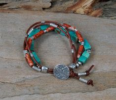 Love this piece because I really dig the combination of this turquoise with the orange flare of jasper. It reminds me of a southwest vibe. Four strand bracelet accented with Hill Tribe sterling silver and spiral button closure. Unique piece with the squares and tubes and colors ... this bracelet will be noticed for sure. Great to pair with jeans and white boho peasant blouse or your fav brown dress. Or any other outfit for that matter.  This bracelet is made to order therefor each piece is beautifully unique and may vary slightly...just like you. (: Packaged in a teal burlap sunflower bag with yellow ribbon and charm. Made with good vibes. Earthy Turquoise Bracelet Jewelry, Adjustable Jasper Jewelry In Turquoise, Bohemian Jasper Bracelet, Turquoise Multi-strand Bracelets With Colorful Beads, Turquoise Hand-wrapped Hippie Beaded Bracelets, Southwest Vibes, Turquoise Multi-strand Wrap Bracelet, Nickel-free Southwestern Turquoise Beaded Bracelets, Handmade Turquoise Leather Bracelet, Bohemian Style