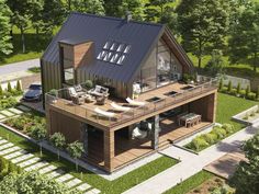 an aerial view of a house in the woods