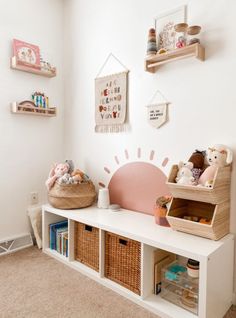 a room with shelves, baskets and stuffed animals