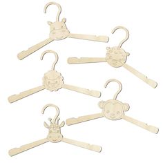 wooden clothes hangers with monkey faces and monkeys on the front, one in white