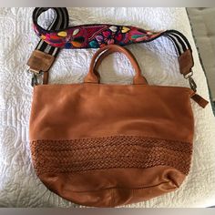 Beautiful Boho Vibe Genuine Leather Handbag In Saddle Brown. Handbag Made In India. Included Is A Brand New Embroidered Bag Strap Made In Guatemala. Bag Was Only Used Once. Not My Daughters Style. Originally Paid Well Over $200 For Both In May. Selling For Only $75. Turquoise Purse, Purple Handbags, Green Purse, Saddle Brown, Gorgeous Leather, Brown Handbag, Black Leather Crossbody Bag, Coach Shoulder Bag, My Daughters