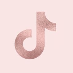 the letter j is made up of pink foil and has a metallic effect on it