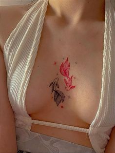 a woman's chest with a butterfly tattoo on it