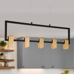 a kitchen with some lights hanging from the ceiling