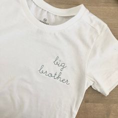 Simple and sweet! These cotton tees are made from 100% organic cotton. Please choose a thread color and font style at checkout. If no thread color is chosen, the default will be black. For sizes 12 months and smaller, the design will be stitched in the center of the t-shirt or bodysuit. In lieu of a white shirt you can have this design stitched on a fleece sweatshirt. If you are wanting a different design, more wording, or a different clothing style, please send me a message so we can discuss th Baby Shirts Embroidered, Big Brother Shirt Embroidered, Big Brother Embroidered Shirt, Big Brother Little Sister, Disney Birthday Shirt, Big Brother Shirt, Brother Shirts, Big Sister Shirt, Sister Shirts