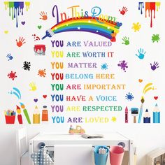 this is an image of a child's room with rainbows and hand prints on the wall