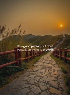 a path leading up to the top of a hill with a quote on it that reads be a good person, but don't waste time trying to prove it