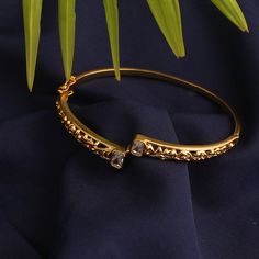 Description: Inspired by the rich tribal culture, this bangle by Tarinika is eclectic and has an earthy feel to it. It is gold plated with oxidized finish to give the definite earthy charm. Style with other jewelry from Maati Collection for a complete look. Details & Specifications: Materials used: Brass Alloy with Antique Gold Plating Weight -Bracelet:- 12 gm Length - Bracelet:- 6 cm Make it custom Want to make it a custom bracelet? Sure! Reach out to us at support@tarinika.com and we’ll be hap Gold Bracelet Simple, Indian Jewelry Sets, Bangles Jewelry Designs, Gold Jewelry Simple, Gold Bangles Design, Bangle Designs, Antique Necklace, Antique Earrings, Gold Jewellery Design