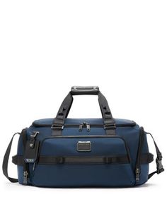 This spacious and modern duffel bag fits travel and workout essentials, alike. It features an expandable shoe compartment with a water-resistant lining. The addition of daisy chains makes it compatible with TUMI+ accessories to further enhance its functionality. Sold separately. Alpha Bravo brings you rugged yet refined pieces that will take you from the office to the outdoors and beyond. Daisy Chains, Travel Products, Workout Essentials, Rug Bag, Daisy Chain, Fabric Bags, Online Bags, Recycled Fabric, Weekender Bag