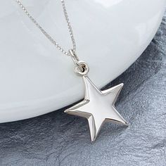 "Sterling Silver Star Necklace, Celestial Jewelry, High Polished 925 Silver Star Pendant, Lucky Star Birthday Necklace, FREE SHIPPING This brilliant 925 sterling silver star is 2 mm thick and gently tapers towards the points. This necklace is a classic look and is easy and versatile with any style of dress. Makes a great gift for mom, wife, friend, sister, daughter, or girlfriend. OVERVIEW: * Beautiful, elegant, bright and sturdy 14, 16, 18, 20, or 22 inch 925 sterling silver chain. Choose from Silver Star Charm Necklaces For Anniversary, Silver Star Charm Necklace For Anniversary, Silver Star Charm Necklace, Silver Star-shaped Personalized Necklace, Silver Necklaces With Star Charm, Silver Star Charm Necklaces, Silver Birthday Jewelry With Star Charm, Silver Jewelry With Star Charm For Birthday, Personalized Silver Star Necklace