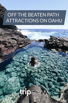 a person swimming in the water near some rocks with text overlay that reads, off the beaten path attractions on oahuu