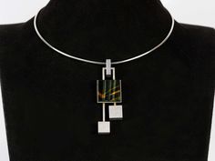 "ArtDecoGalaxy presents: a Vintage modernist tiger eye and sterling silver necklace in cubist style, Circa 1970s. Measures 20cm (7.87\") total, 7cm (2.75\") by 2,2cm (0.87\") the pendant, 13cm diameter. Wear consistent with use and age, no damage or repairs, in excellent vintage condition. The shipping cost is for Standard Registered Mail. Delivery estimates can vary depending on the time the parcels are in customs or for other reasons outside of our influence. We do not refund any items that ha Torque Necklaces, Shipping Documents, Modernist Jewelry, Carving Designs, Rose Quartz Ring, Georg Jensen, Metal Work, Silver Roses, Sterling Silver Necklace