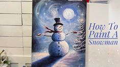 a painting of a snowman is on display in front of a sign that says how to paint a snowman