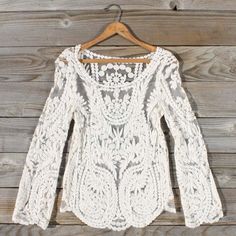 Soft ivory crochet details adorn this sweet blouse. An intricate crochet design pairs with long sleeves and a sweet rounded hem. Semi-sheer design with a darling rounded neckline. Color: Ivory 100% cotton Imported Hand wash cold split Small/Med Med/Large Bust 37 39 Waist 36 38 Hips 38 39 Length 27 27 Bust, waist, and hip measurements are a total circumference. Length is measured from the top of the blouse to the hem. Measurements are an estimate. Top For Skirt, Vintage Lace Top, Ellie Saab, Bohemian Tops, Dress Sweater, Bohol, White Lace Top, Marchesa, Lace Blouse