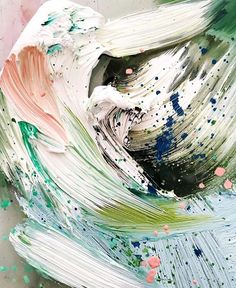 an abstract painting with white, green and pink colors