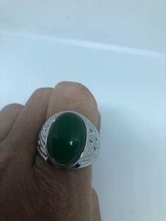 Large green nephrite jade Ornate German Silver Vintage ring, does not tarnish, NOT sterling Sizes 9, 10 and 11 All rings are shipped in a nice gift box. Check out our over a THOUSAND great reviews Engraving is $4 per letter and is not always perfect depending on the piece. It can take a few days if the jeweler is busy. This is payable to Paypal Judithsltd@gmail.com Green Polished Finish Rings As Gift, Green Rings With Polished Finish As Gift, Green Polished Finish Rings For Gift, Green Round Signet Ring For Anniversary, Gift Emerald Green Ring With Polished Finish, Gift Green Emerald Ring With Polished Finish, Classic Green Signet Ring For Gift, Green Jade Ring As A Gift, Green Hallmarked Signet Ring As Gift