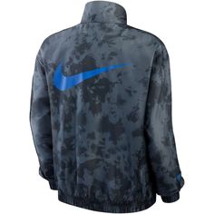 Keep your style game going strong in rainy weather with this USMNT Essential jacket from Nike. It features elastic trim that helps you stay dry and a full-zip closure for maintaining the ideal temperature. USMNT graphics are accentuated by the coordinating colorway and eye-catching design. Imported Full Zip Long sleeve Oversized fit Material: 100% Polyester Two side pockets Move To Zero is Nike's journey toward zero carbon and zero waste to help protect the future of sport. Apparel labeled susta Nike Technical Outerwear For Outdoor, Nike Technical Outdoor Outerwear, Nike Sports Outerwear With Zipper Closure, Nike Technical Moisture-wicking Outerwear, Fall Technical Moisture-wicking Track Jacket, Technical Windproof Windbreaker For Fall, Fall Technical Outerwear With Moisture-wicking, Functional Weatherproof Track Jacket For Fall, Technical Moisture-wicking Fall Outerwear