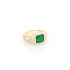 Beautifully crafted from 14K yellow gold, this stunning bombe ring features an emerald-cut emerald centerpiece surrounded by shimmering pave diamonds with trillion cut white diamonds on each side. An exquisite choice for special occasions, this classic glamour piece is sure to make a statement. 14K yellow gold Emerald (Emerald cut); Diamonds, approximately 2.98 carats Dimensions: 14mm x 12mm Size 8 One of a kind Designed in California Style number: SRG086-8 Luxury Trillion Cut Emerald Ring For Formal Occasions, Luxury Trillion Cut Diamond Emerald Ring, Luxury Trillion Cut Emerald Diamond Ring, Luxury Green Diamond Ring With Pave Setting, Green Diamond Signet Ring In Fine Jewelry Style, Luxury Gold Emerald Ring With Pave Setting, Gold Emerald Cut Ring With Pave Setting, Luxury Green Rings With Baguette Diamonds, Bombe Ring