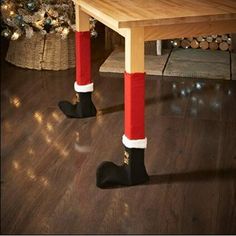 there is a wooden table with red and white stockings on it