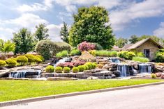 there is a waterfall in the middle of this yard