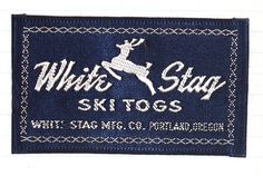 a white stag logo on a blue cloth