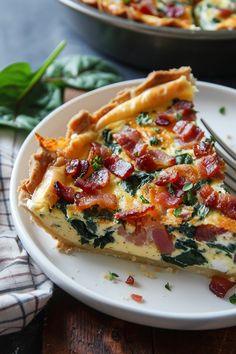 a slice of quiche with bacon and spinach