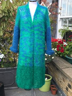 All year women's knit long sleeves sweater. Very light weight, warm and cosy hand knitted mohair cardigan, made from green and sky blue mohair mixtures: 78% mohair, 13% wool, 9% nylon. Made in England.  The length approx. 112cm, 44 inches. One size will fit size S-XL. Gift idea for wife, mum or mother in law. Warm hand wash, cold rinse well, dry flat in shade. Green Knitted Acrylic Cardigan, Winter Green Knitted Cardigan, Green Knitted Winter Cardigan, Green Knitted Outerwear For Layering, Cozy Green Acrylic Cardigan, Green Cozy Acrylic Outerwear, Green Mohair Cozy Sweater, Cozy Green Mohair Sweater, Green Soft Knit Sweater Coat