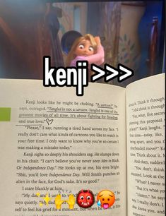 an open book with the words keni > > on it, and two cartoon characters