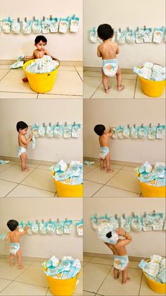 a little boy that is standing in front of a tub with diapers on it