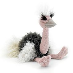 an ostrich stuffed animal sitting on the ground