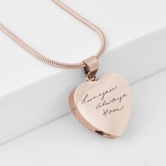 Hold onto the words of your loved ones with our exclusive handwriting jewelry. Each heart urn charm is engraved with their actual handwriting, ensuring you can always feel their presence. A small space within the heart will hold a small amount of ashes. Premium materials make each piece as durable as it is precious.Please note: The arrangement of text may be changed to fit the charm. See all the pictures above for examples. Gold Urn Necklaces For Ashes, Urn Necklaces For Ashes, Necklaces For Ashes, Gold Urn, Jewelry For Ashes, Personalized Charm Necklace, Handwriting Jewelry, Urn Jewelry, Urn Necklace