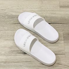 Nwt Girls Size 6 White Calvin Klein Slides/Sandals With Holographic Letters In The Front. White Non-slip Flat Heel Sandals, White Casual Flip Flops With Flat Heel, Casual White Flip Flops, Comfortable White Slides With Flat Heel, White Casual Slides With Flat Heel, Comfortable White Flat Heel Slides, White Closed Toe Casual Flip Flops, Casual White Closed Toe Flip Flops, White Closed Toe Casual Slides