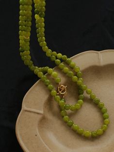 Add a touch of natural elegance to your jewelry collection with this stunning 8mm Fresh Green Grape Gemstone Beaded Necklace. Each bead is carefully crafted from a vibrant Green Grape gemstone, boasting a refreshing hue reminiscent of lush vineyards. The smooth, polished beads are strung together to create a harmonious and eye-catching piece, perfect for both casual and formal occasions. Metal: 18K Recycled Gold Plated On Brass Gemstone: Green Natural Stone 8-9mm Length: 1280mm Weight: 118g Green Grape, Edison Pearls, Green Grapes, Gemstone Beaded Necklace, Tiger Eye Stone, Fresh Green, Vibrant Green, Recycled Gold, Stone Necklace