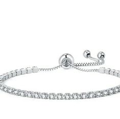 Coming Soon To My Closet. Please Like To Get Discount Notifications. Elegant, Subtle And Regal, This Cz Tennis Bracelet Is A Great Piece To Add To Your Collection. Perfect For Pulling Together A Semi-Casual Outfit Or When You Want To Pair It With Other Pieces For A Night Out. It Will Illuminate Your Look Whenever You Need To, Adding Twinkle And Elegance To Any Outfit. This Radiant And Glimmering Bracelet Makes For A Great Gift. Adjustable Silver Cubic Zirconia Tennis Bracelet, Elegant Chain Bracelet With Sparkling Stones, Fine Jewelry Crystal Bracelets With Diamond Accents, Elegant Round Chain Bracelet With Sparkling Stones, White Gold Crystal Bracelets With Sparkling Stones, Elegant Adjustable Diamond Bracelet, Elegant Adjustable Diamond Bracelet With Brilliant Cut, Crystal Jubilee Bracelet In Fine Jewelry Style, Crystal Fine Jewelry Jubilee Bracelet