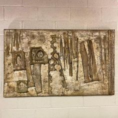 there is a painting on the wall with tools in it