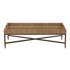 a wicker coffee table with metal legs