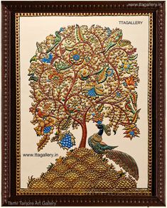 an intricately decorated tree with peacocks and leaves on it's branches, framed in