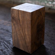 a wooden block sitting on top of a floor