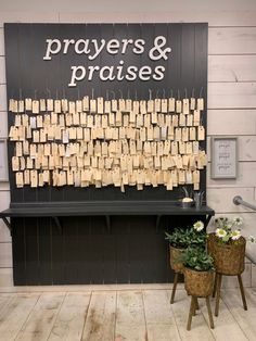 a sign that says prayers and praises with small notes attached to the board